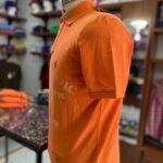 Novelty polo orange lizard print