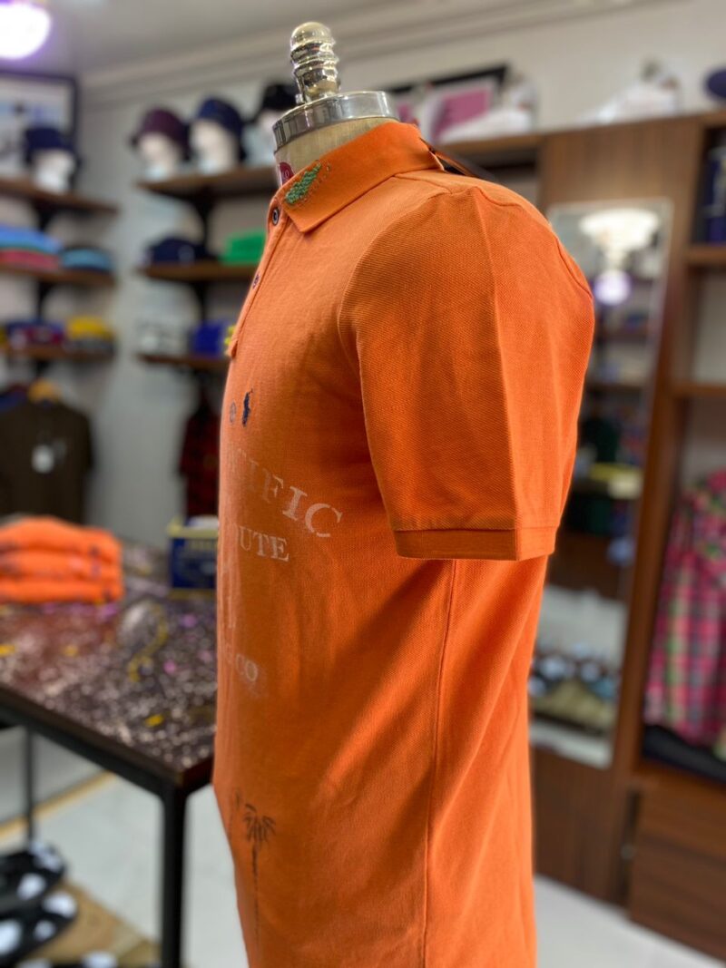 Novelty polo orange lizard print